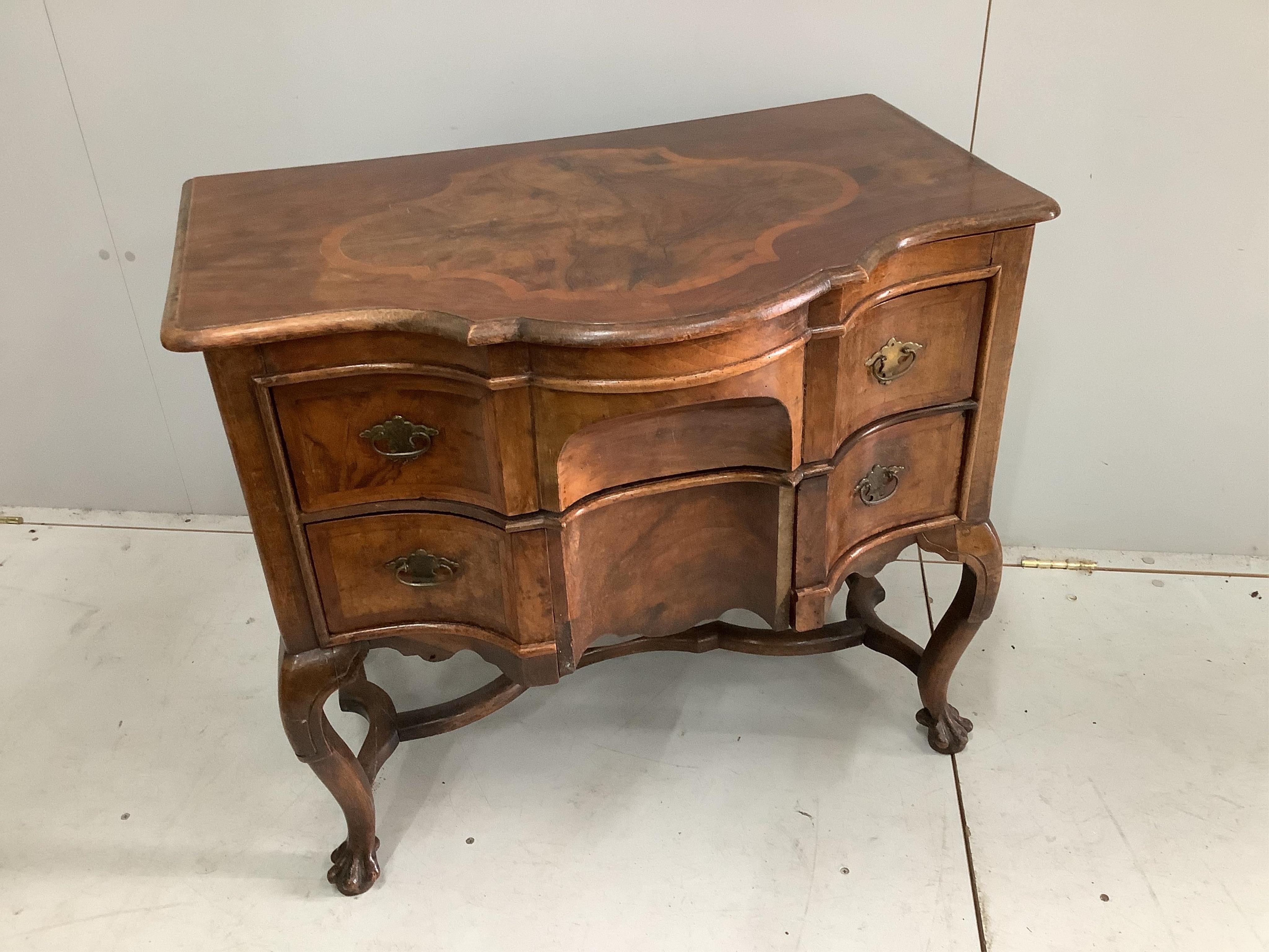 A 19th century Dutch serpentine walnut dressing table with associated triptych mirror, width 83cm. Condition - fair, some losses